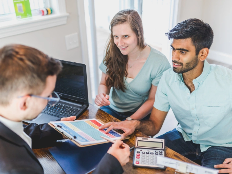 Image of a buyer for real estate talking with a marketer.