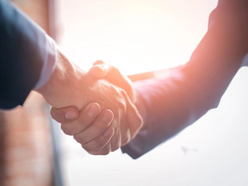 Image representing partnerships (two people shaking hands).